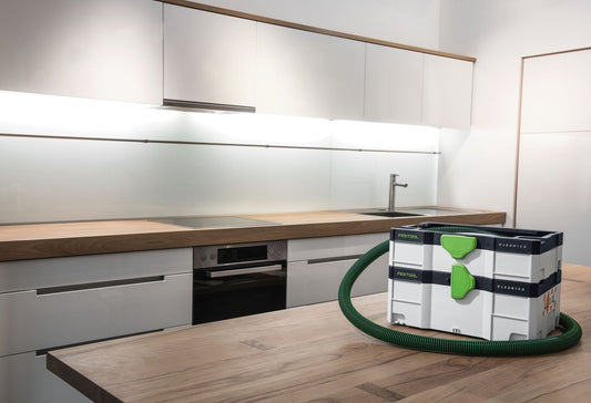 Festool CLEANTEC CTL SYS Absaugmobil im Systainer-Format mit grünem Schlauch in moderner Küche