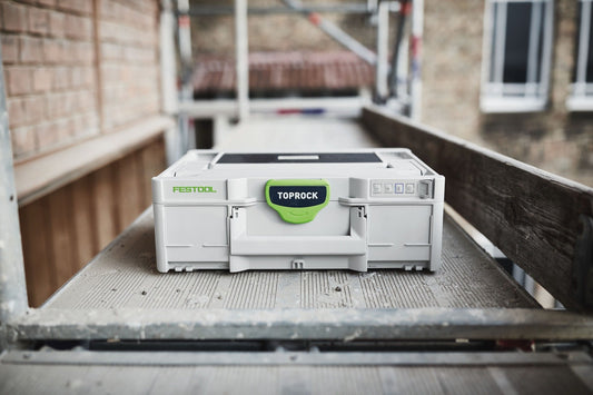 Festool Bluetooth Lautsprecher TOPROCK SYS3 im Systainer auf Baustelle, weiß mit grünem Deckel
